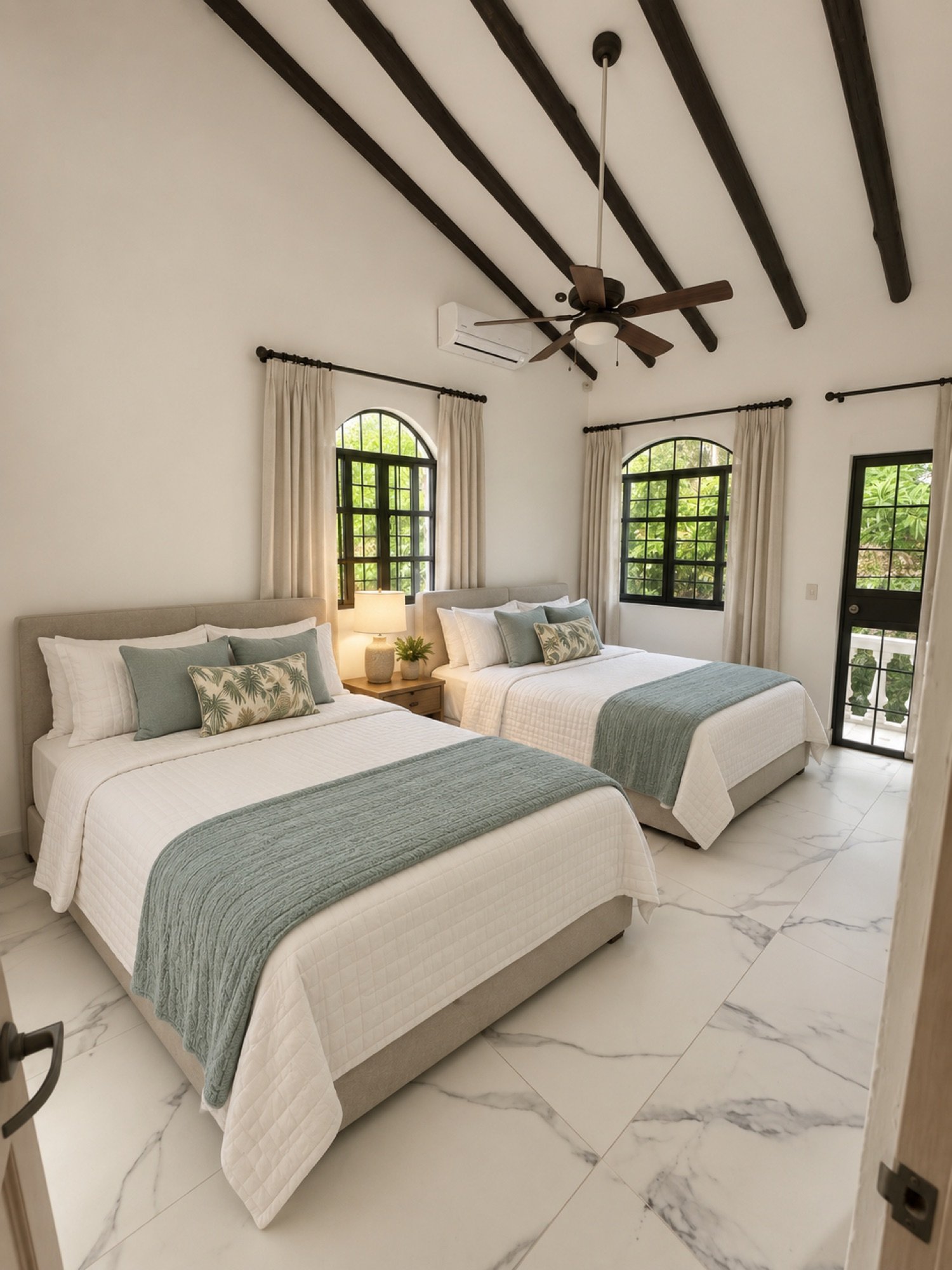 Second bedroom with two beds, arched windows, and beamed ceiling