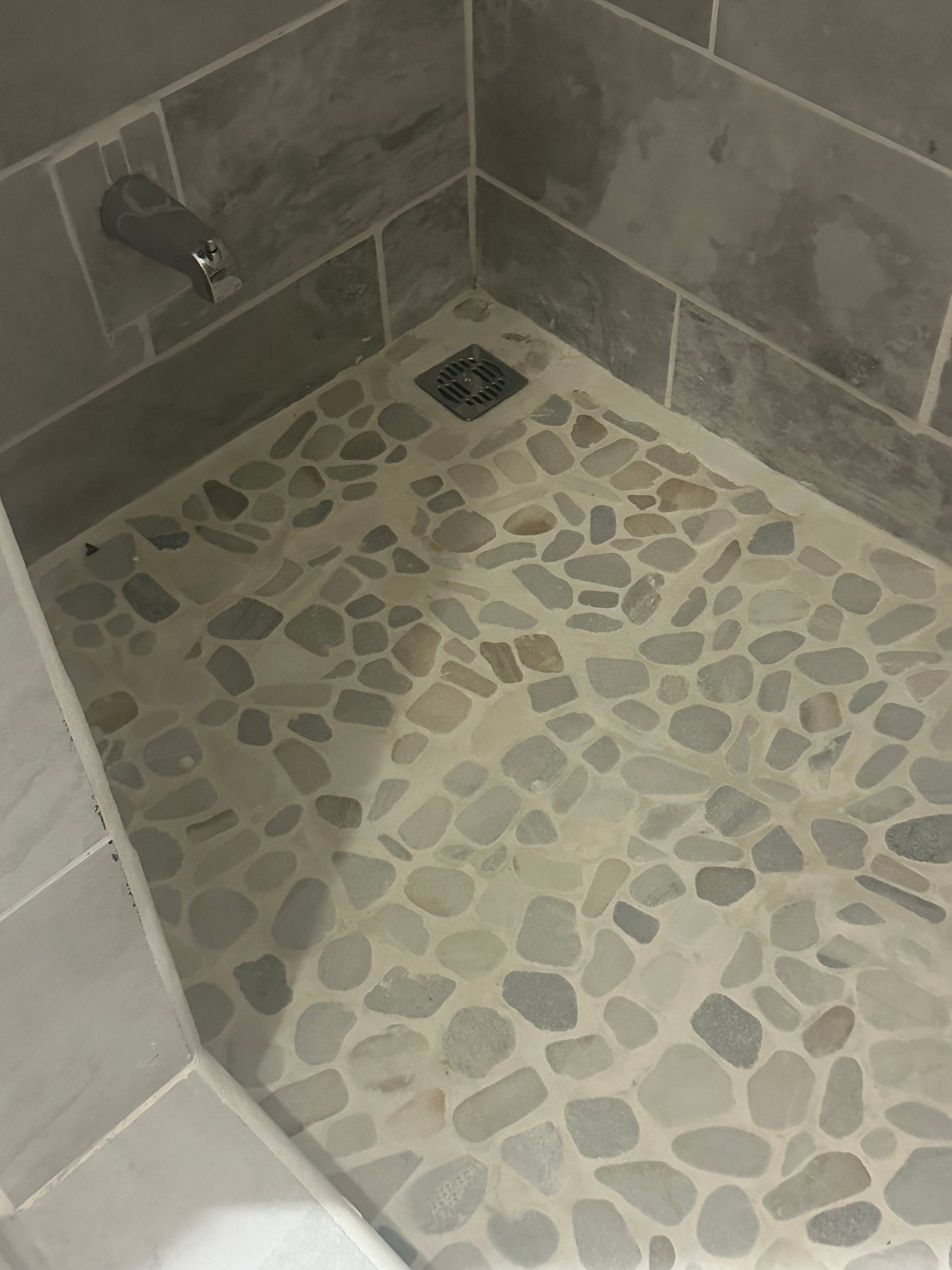 Stone mosaic shower floor